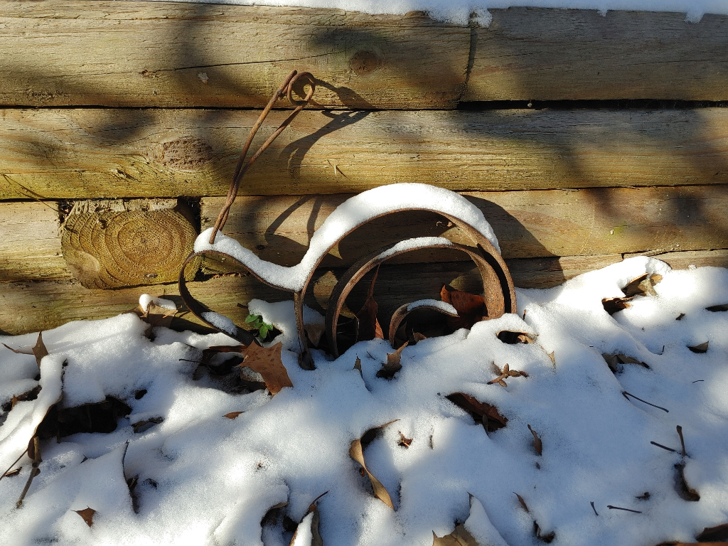 Snow on Rusty Snail Sculpture